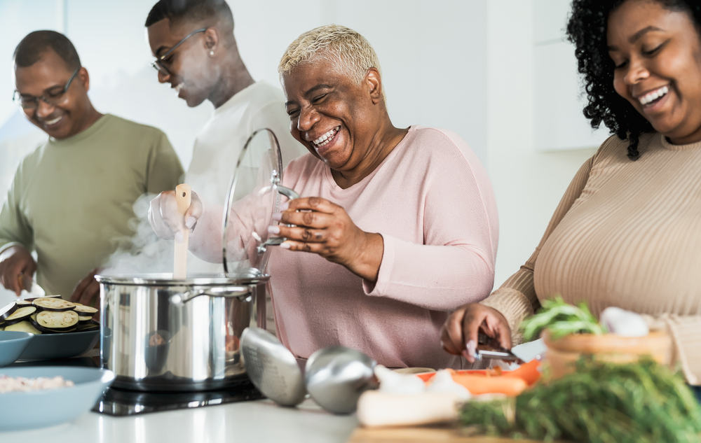 Family cooking together in remodeled kitchen