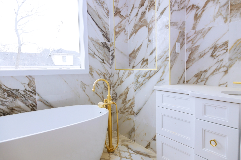 Bathroom Remodel with Gold Fixtures (5 Bathroom Remodeling Ideas that Increase the Value of Your Home)